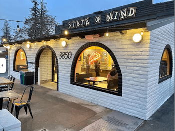 the exterior of state of mind restaurant at night